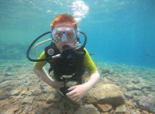Child doing PADI Bubblemaker dive in Dahab Egypt