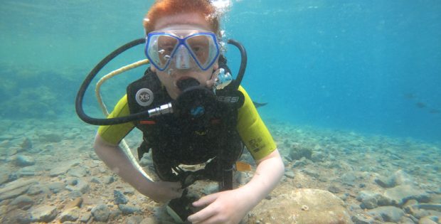 Child doing PADI Bubblemaker dive in Dahab Egypt